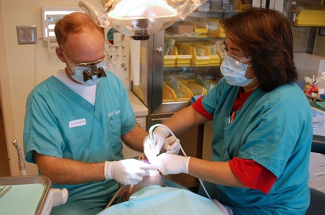 dentist and assistant with patient